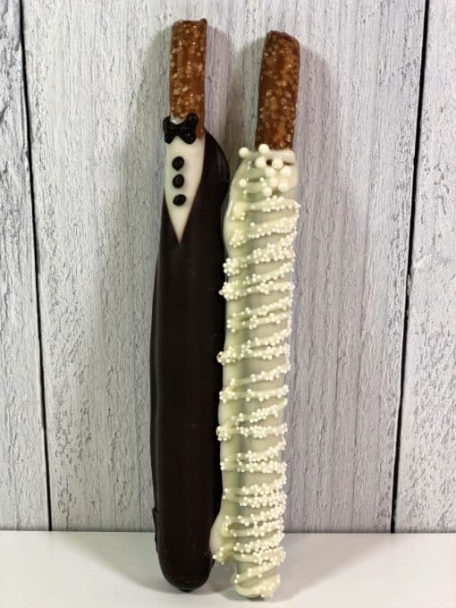 pretzel rods dipped in chocolate and hand decorated for wedding