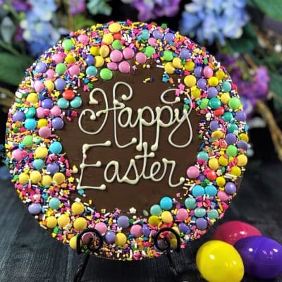 Chocolate Pizza on grey table with Easter eggs