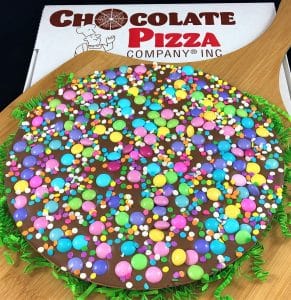 celebrate spring chocolate pizza with pastel candy and sugar confetti