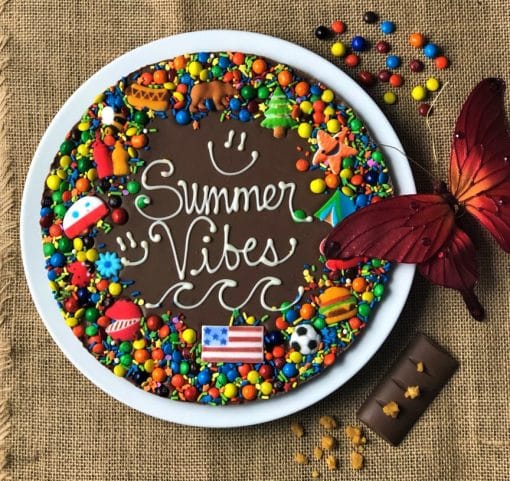 summer vibes chocolate pizza on white plate