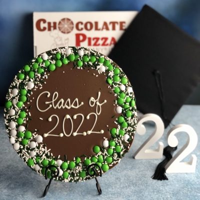 graduation chocolate pizza with green and white candies