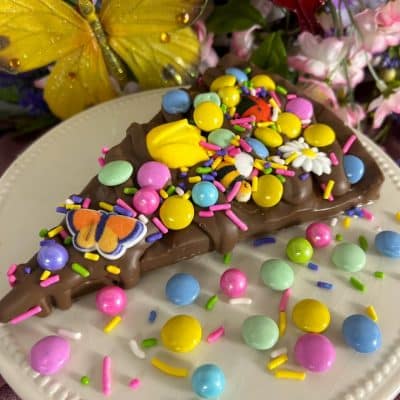 chocolate pizza slice with pastel candies for mother's day
