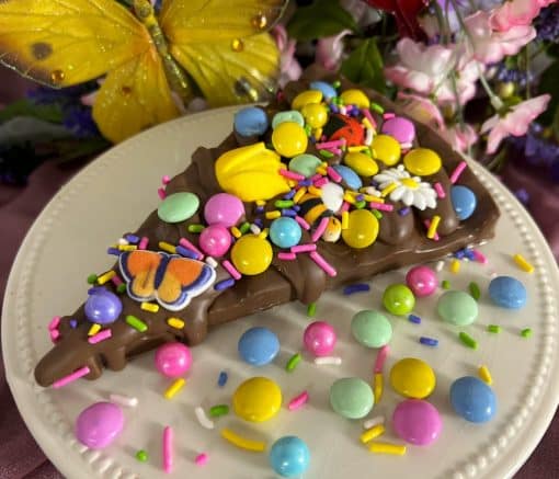 chocolate pizza slice with pastel candies for mother's day