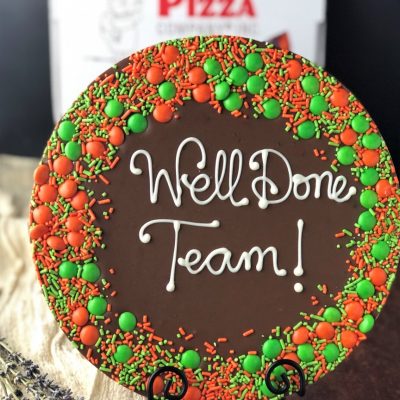 say it on chocolate with custom chocolate pizza that reads well done team