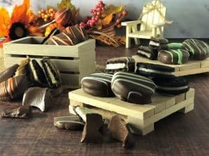 chocolate dipped cookies in vanilla, mint and peanut butter