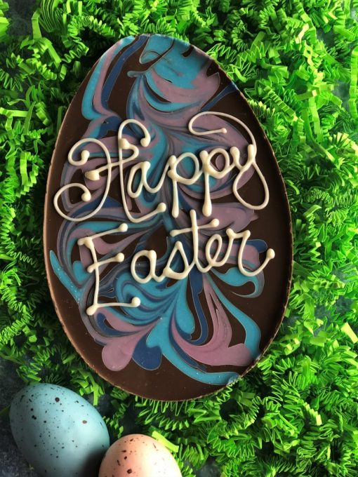 Happy Easter chocolate egg with pastel swirls