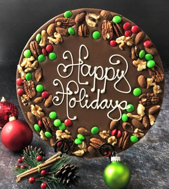 Chocolate pizza that says Happy Holidays