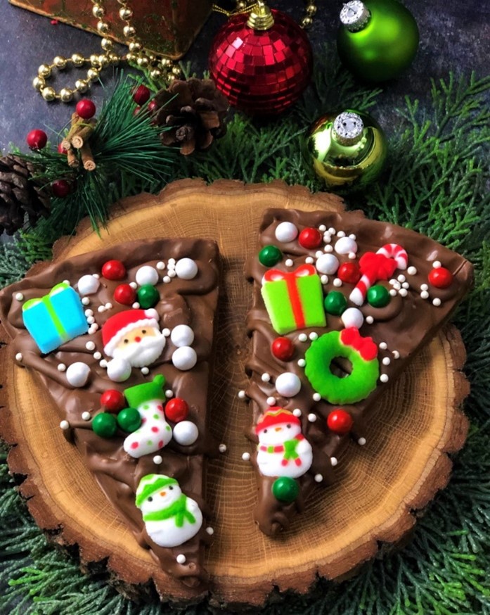 Chocolate pizza slices with Christmas themed sprinkled 