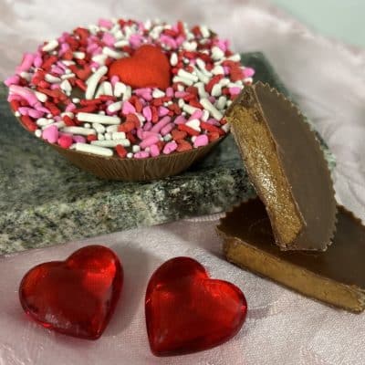 Peanut butter cup decorated with red sprinkles for Valentines Day